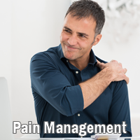 man holding shoulder - pain management